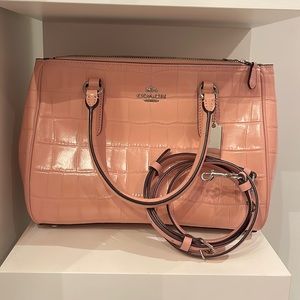 Coach Pink Crocodile-embossed leather with smooth leather details.